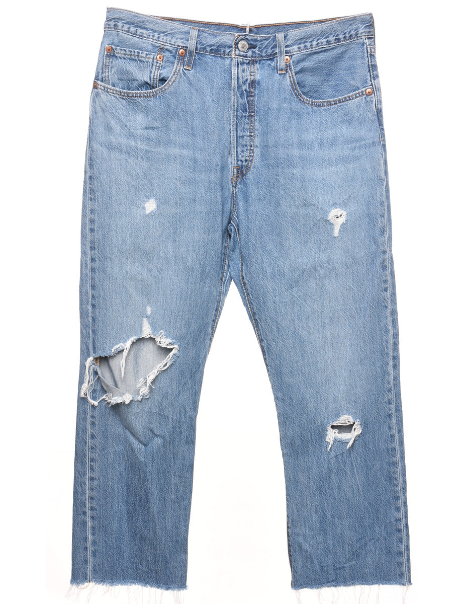 Distressed levi jeans on sale